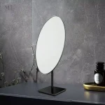 Miroir bronze ovale sur pied 18 x 30 cm