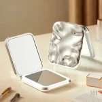 Miroir compact avec éclairage LED intégré