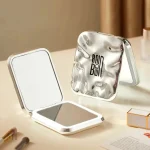 Miroir portable avec grossissement x2 pratique