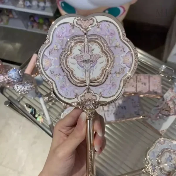 Accessoire beauté pratique, miroir rose avec finition sculptée