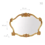 Miroir design doré au style baroque pour sublimer un intérieur