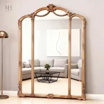 Grand miroir mural doré avec design en triple arche