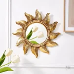 Miroir mural rond doré au design contemporain
